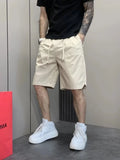 Khaki relaxed fit wide-leg drawstring shorts, side pockets and stitched hem