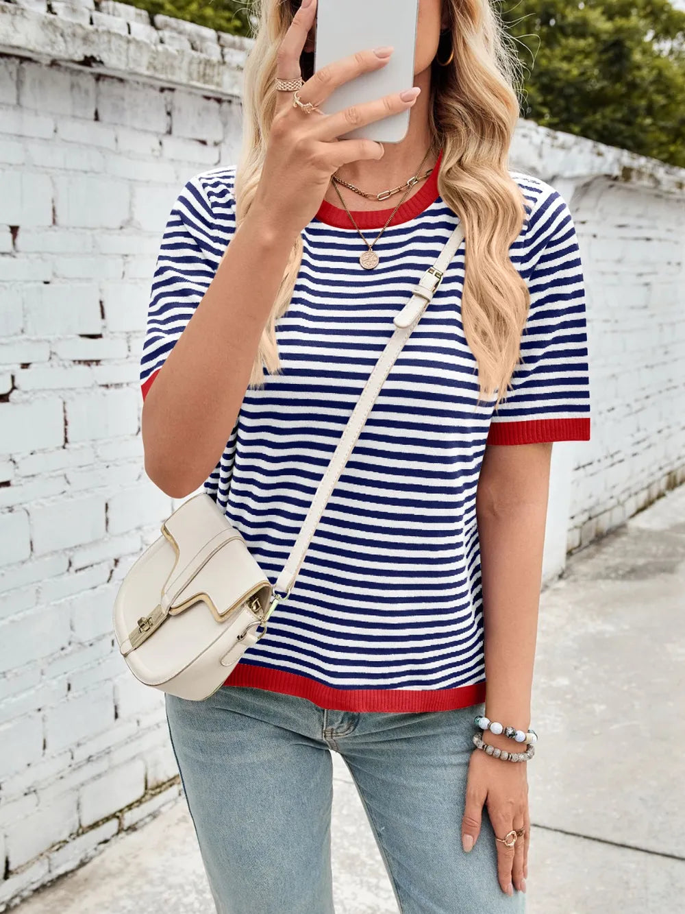 Navy and white striped knit top with red contrast round neck and half sleeves
