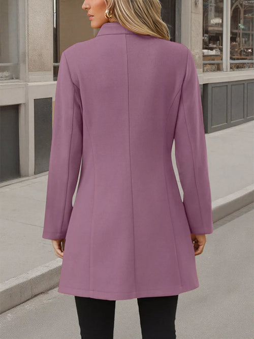 Purple long sleeve coat, back view with curved hem and buttoned design.