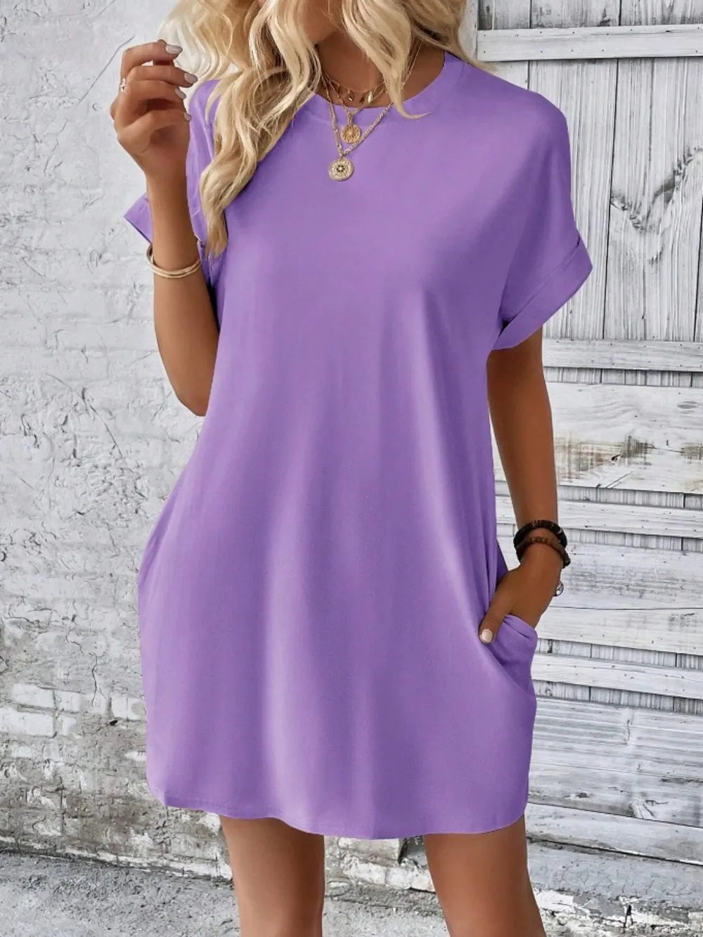 Lavender short-sleeve round-neck tunic dress with loose fit and slightly flared skirt