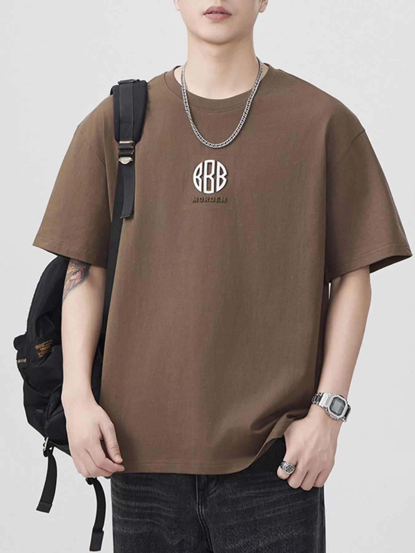 Brown front-view round-neck short-sleeve T-shirt with chest logo