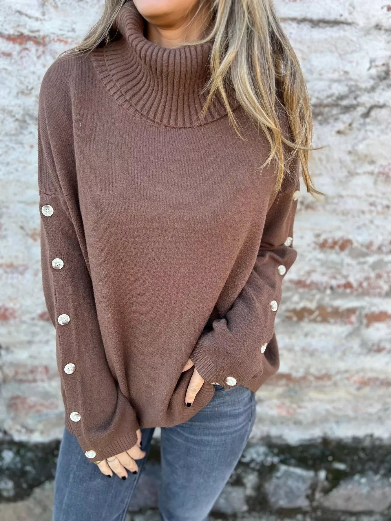 Mocha-brown turtleneck long-sleeve sweater with ribbed collar and buttoned cuffs