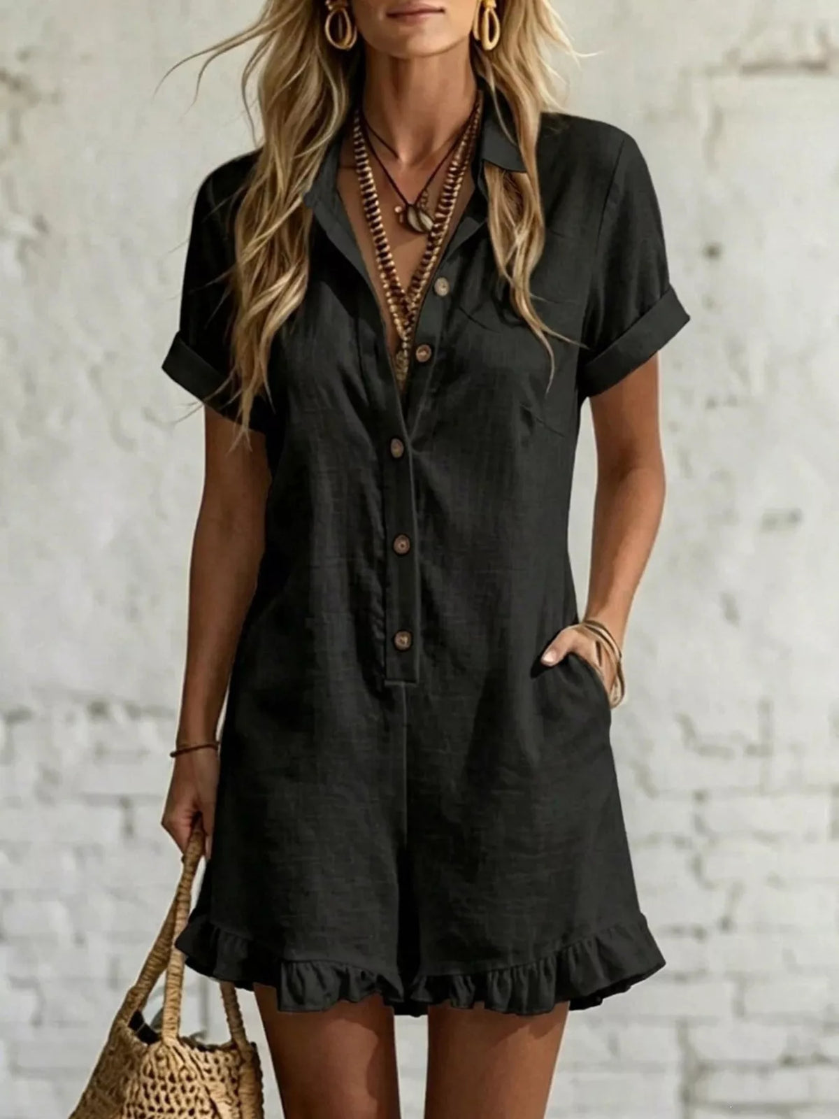 Black button-front ruffled pocket romper with short sleeves