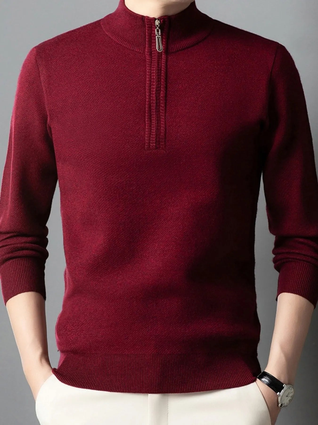 Burgundy quarter-zip long-sleeve sweater with ribbed cuffs and half-zip neckline