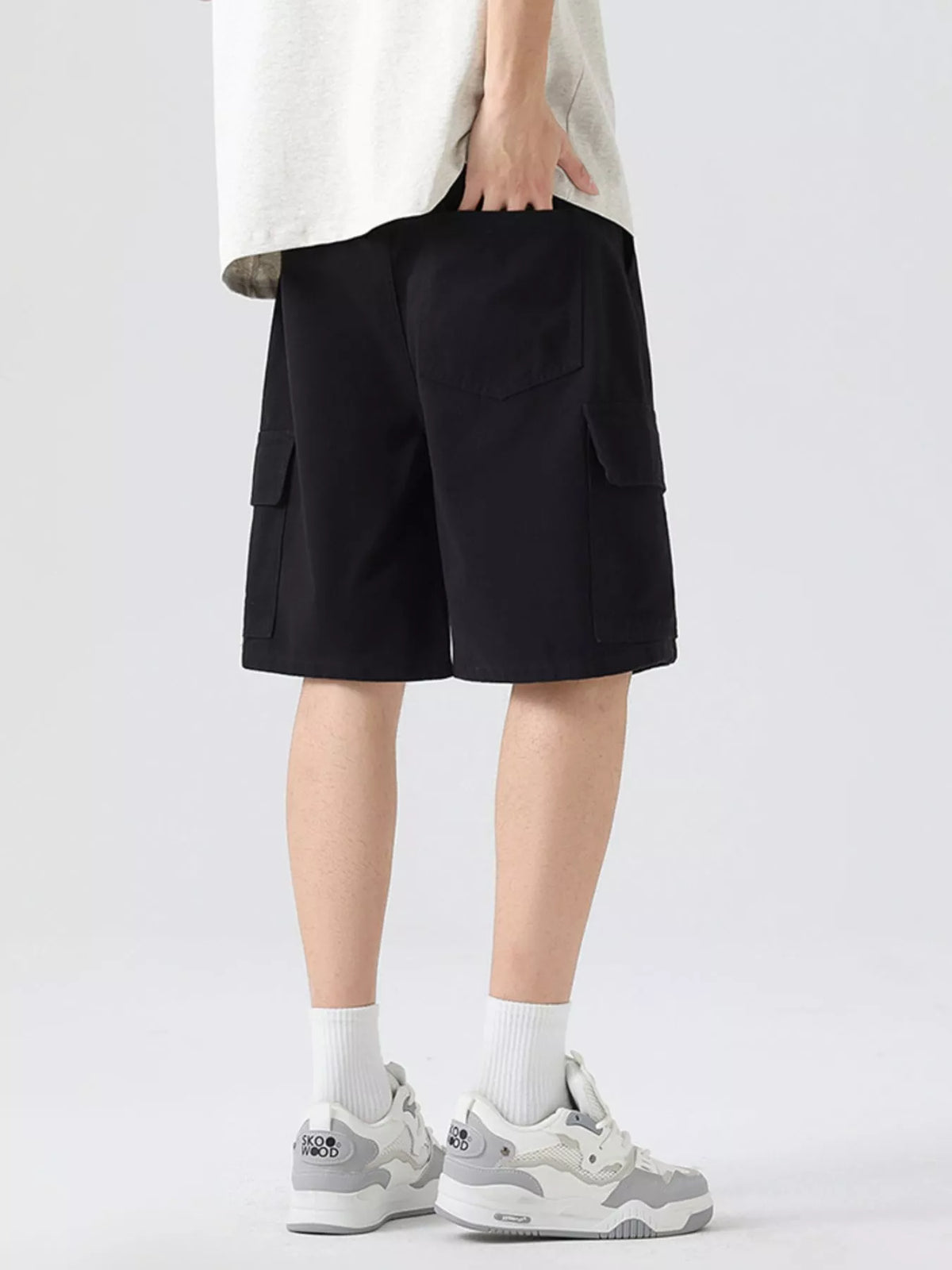 Men's black cargo shorts with drawstring waist and side cargo pocket detail.