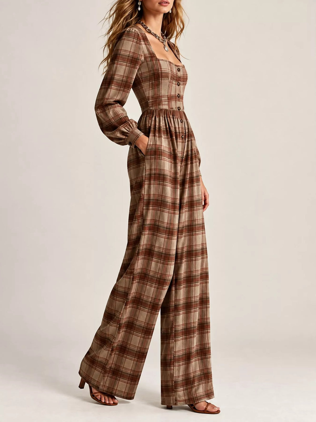 Plaid square-neck long-sleeve jumpsuit in brown tones with button front and drape