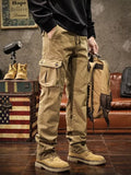 Mens multi-pocket drawstring cargo pants in mustard with utility side pockets