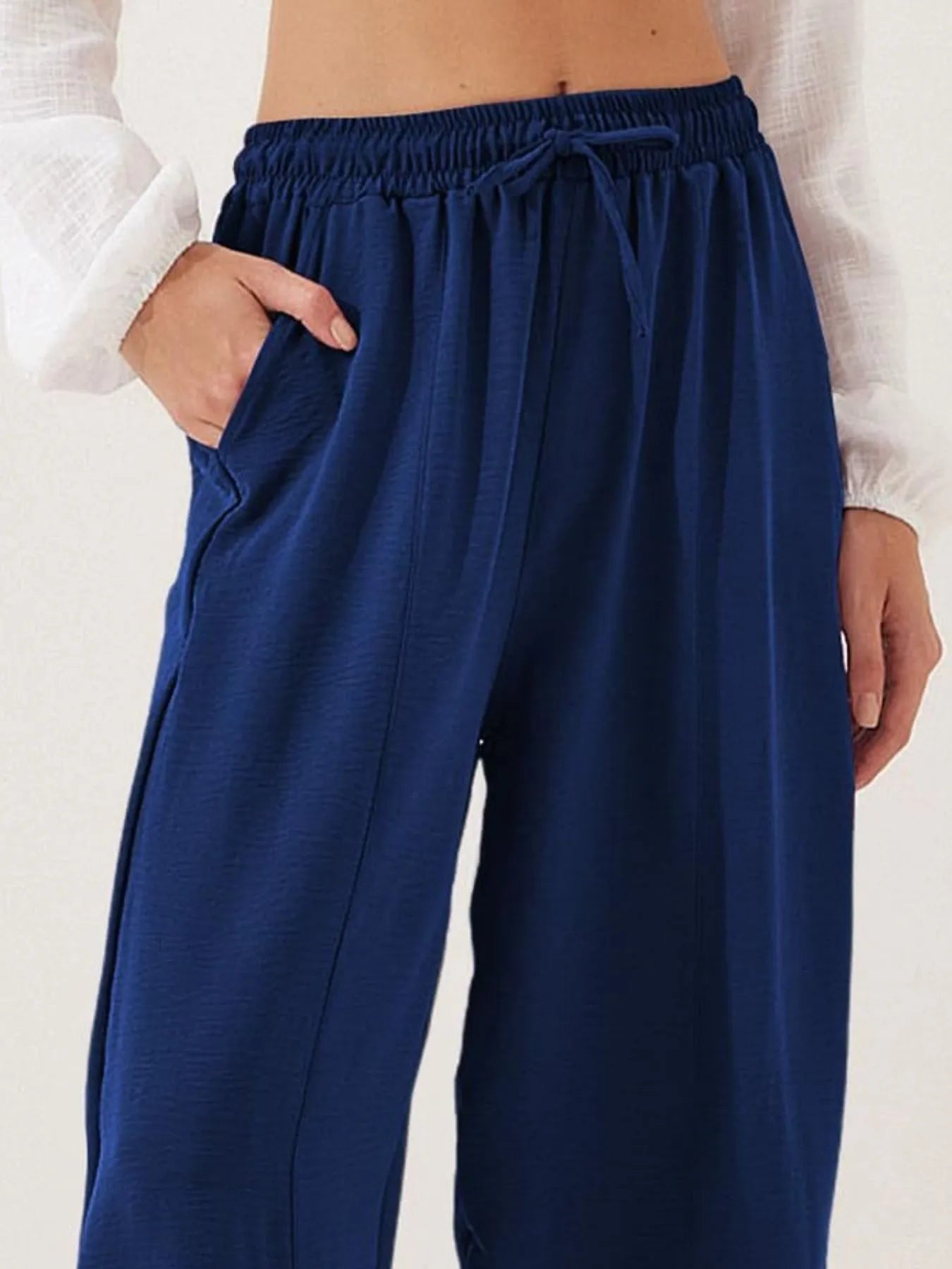 Cropped wide-leg pants in navy blue with ruched elastic waist and drawstring