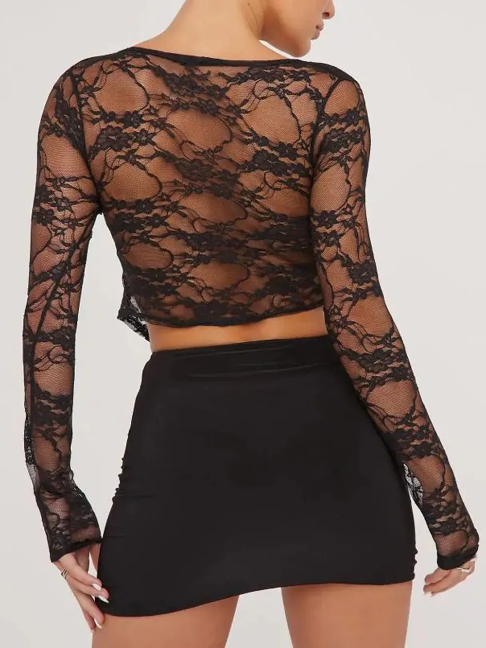 Black lace long-sleeve cropped shirt with open back and floral pattern