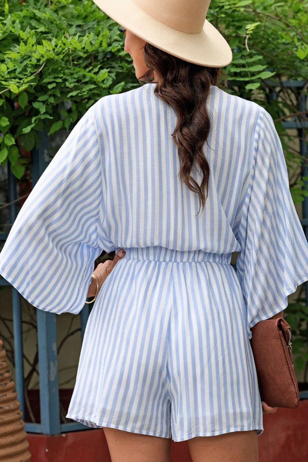 Blue striped kimono sleeve romper with back ties and elastic waist