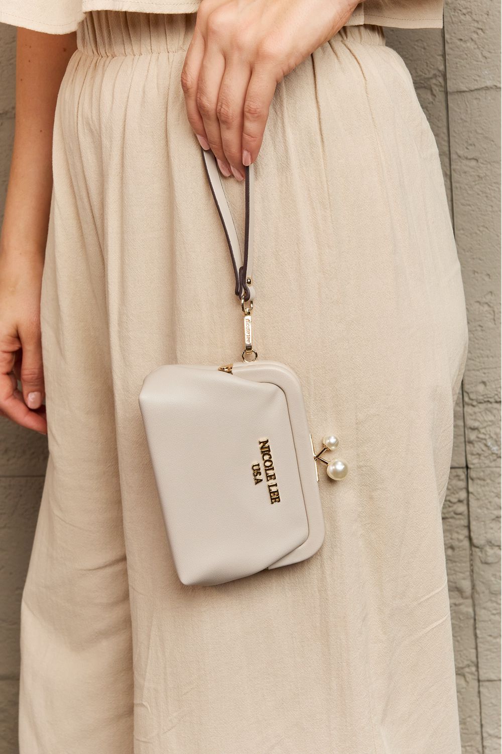Nicole Lee USA Elise pearl coin purse, cream with wrist strap and dangling bead detail