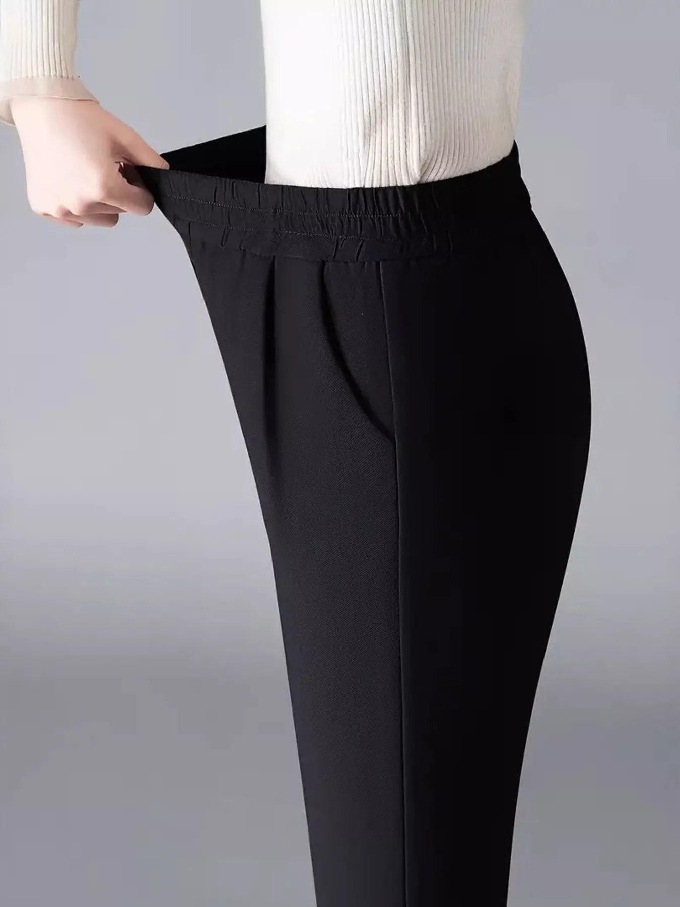 Black elastic waist loose pants with smooth drape and side seams