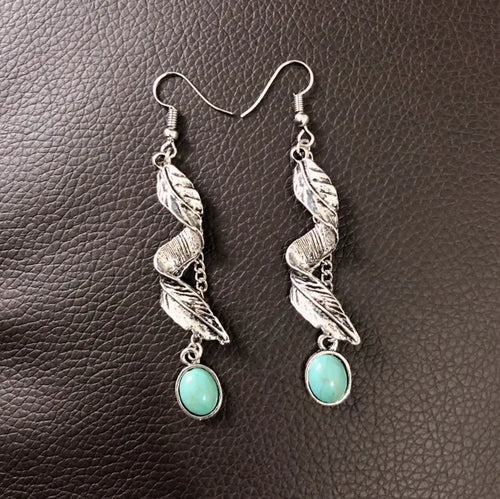 Silver leaf drop earrings with turquoise oval cabochons and chain dangle details