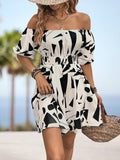 Black and white printed off-shoulder smocked waist dress with puff sleeves.