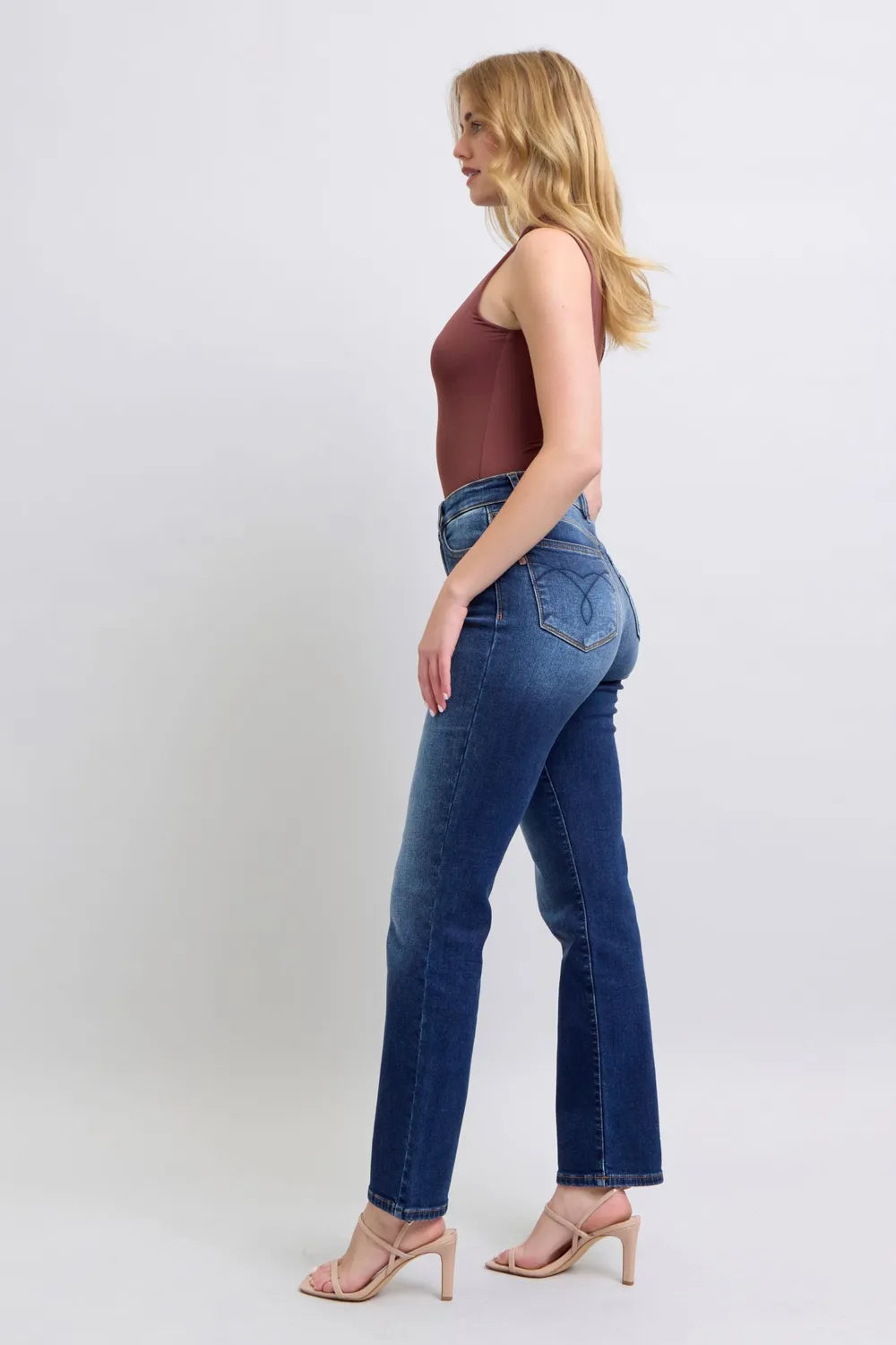 Washed dark blue straight-leg jeans, back/side view with back yoke and pockets