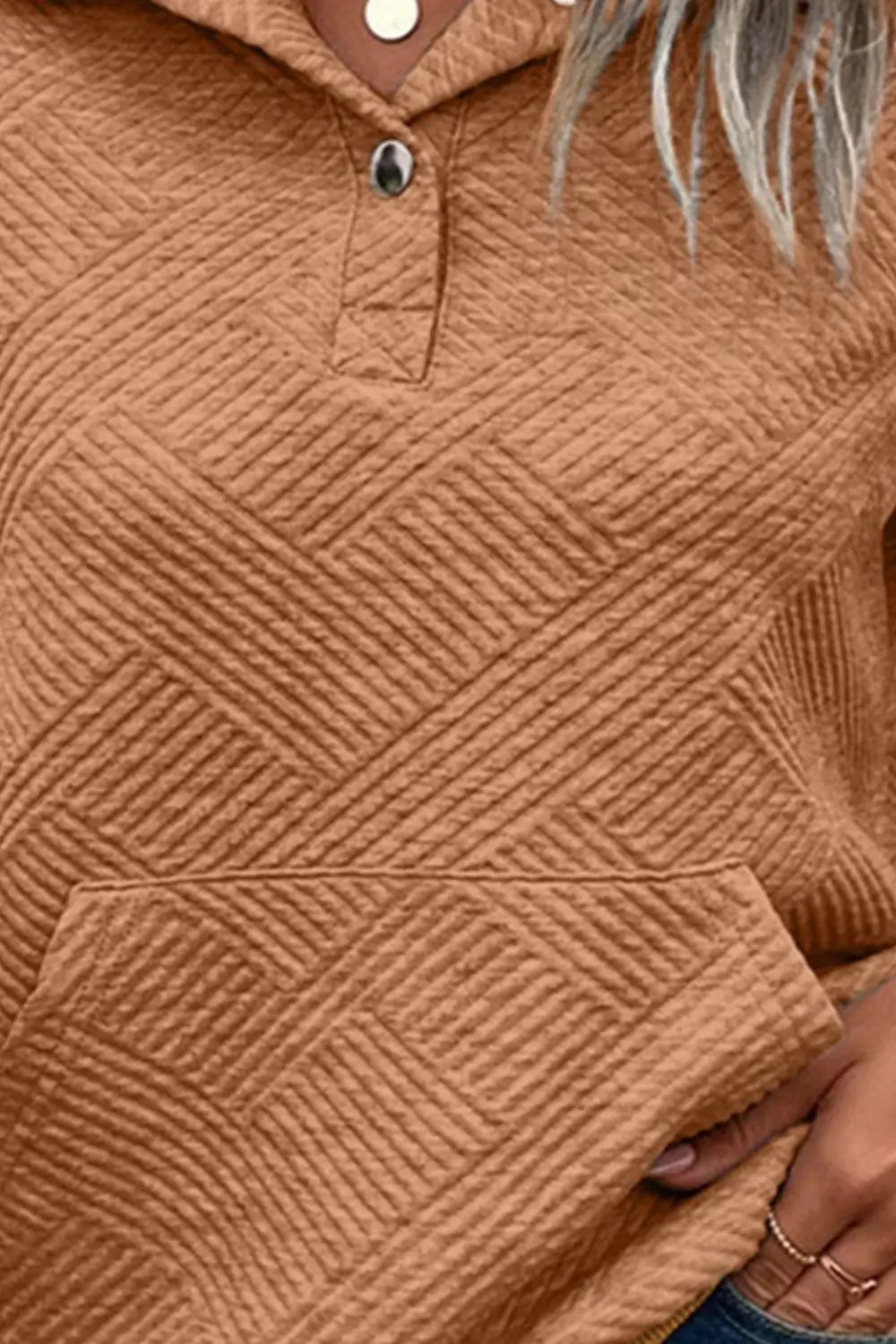 Caramel brown snap-button sweatshirt front detail with textured diamond pattern