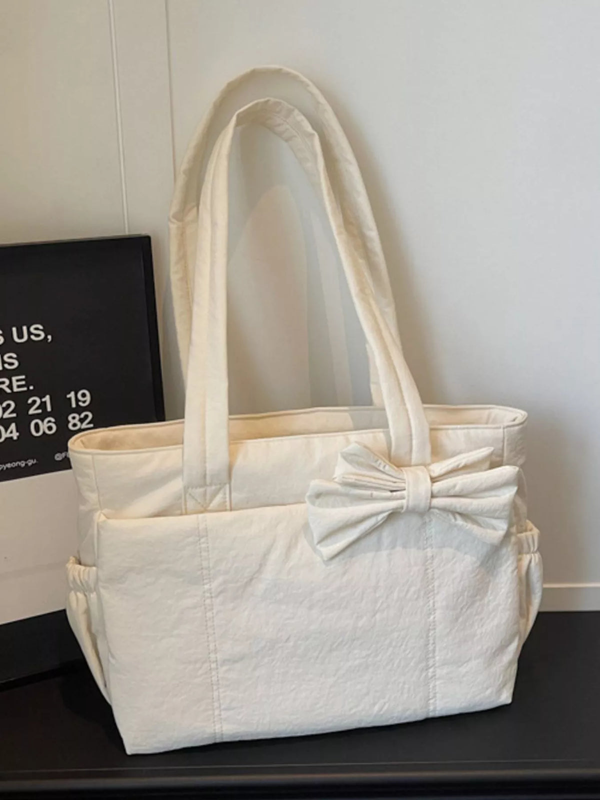 Ivory medium casual tote bag with front bow detail and roomy open top