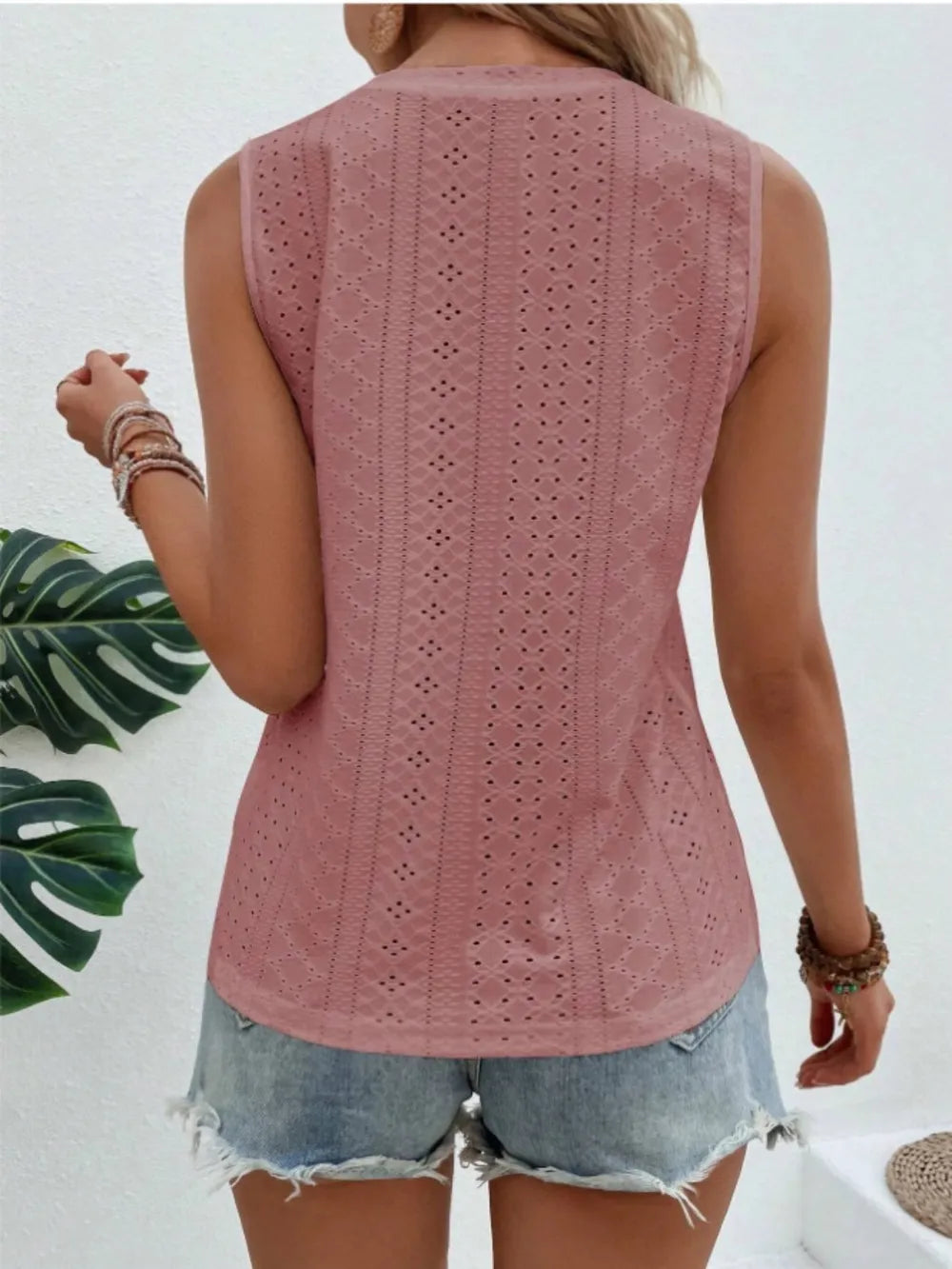Dusty pink eyelet round neck sleeveless tank shown from the back