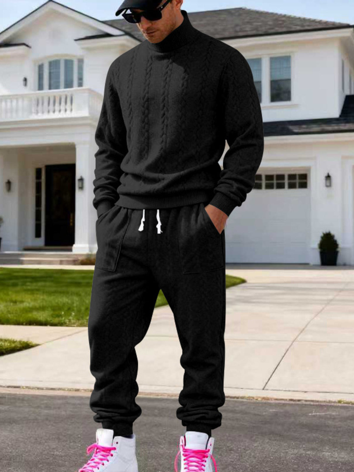 Men's black cable-knit mock neck sweater and jogger set, standing full-body view