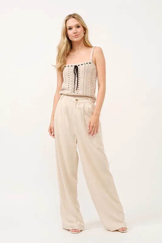 High-rise wide-leg linen-blend pants in oatmeal with button closure and pleats