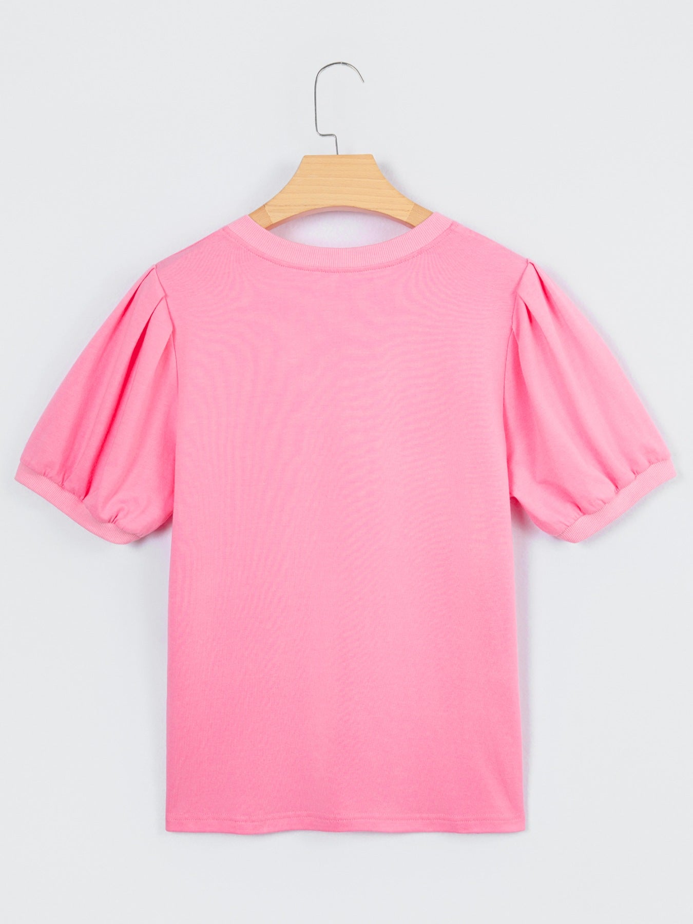 Solid pink V-neck short puff sleeve blouse back view