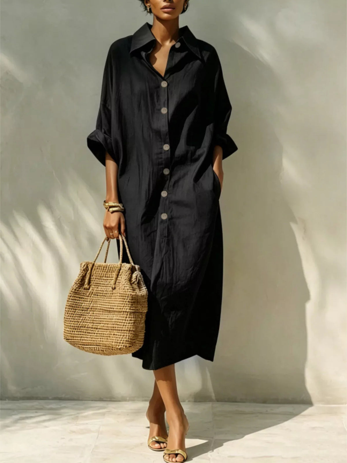 Black button-front shirt dress with short sleeves and collared neckline