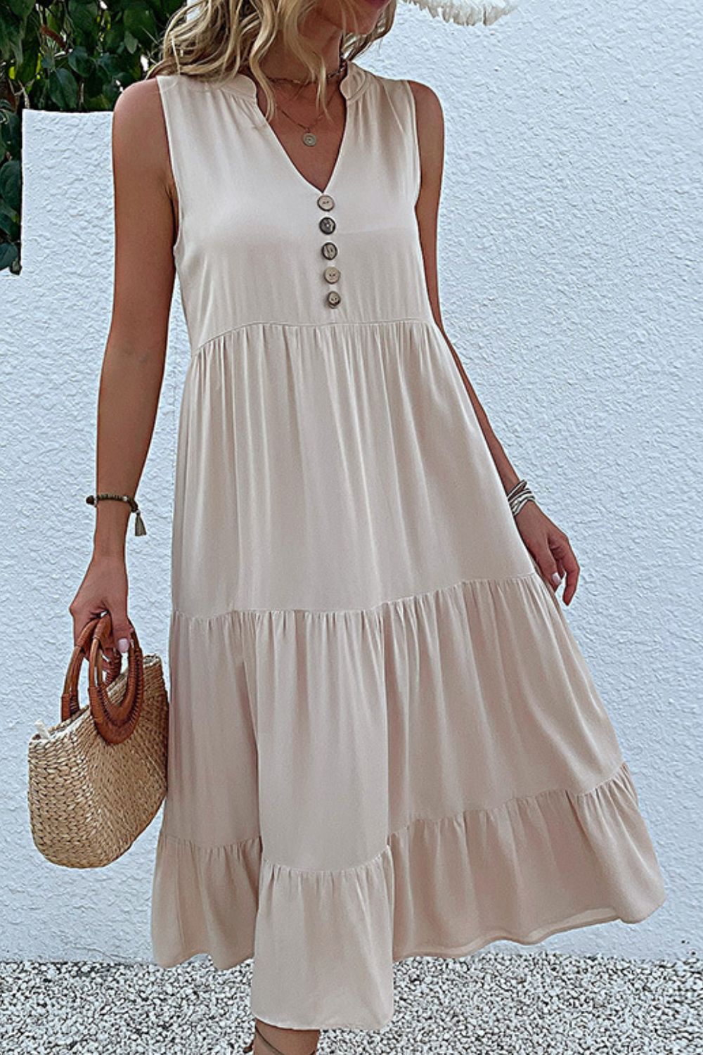 Ivory sleeveless tiered maxi dress with button front and gathered tiers