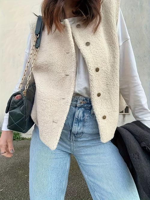 White sherpa button-down vest coat with pointed hem and visible button placket