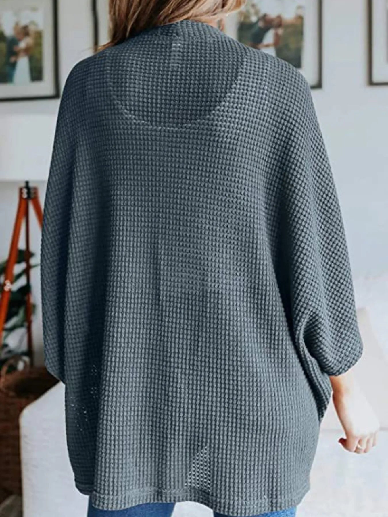 Dark blue waffle knit open-front cardigan with relaxed plus-size fit and three-quarter sleeves