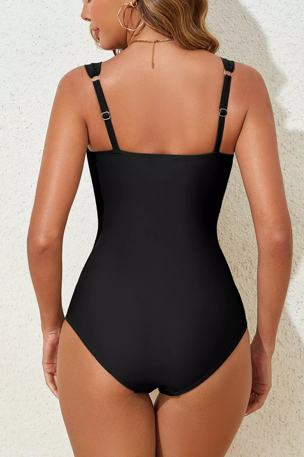 Black one-piece swimsuit back view with adjustable shoulder straps