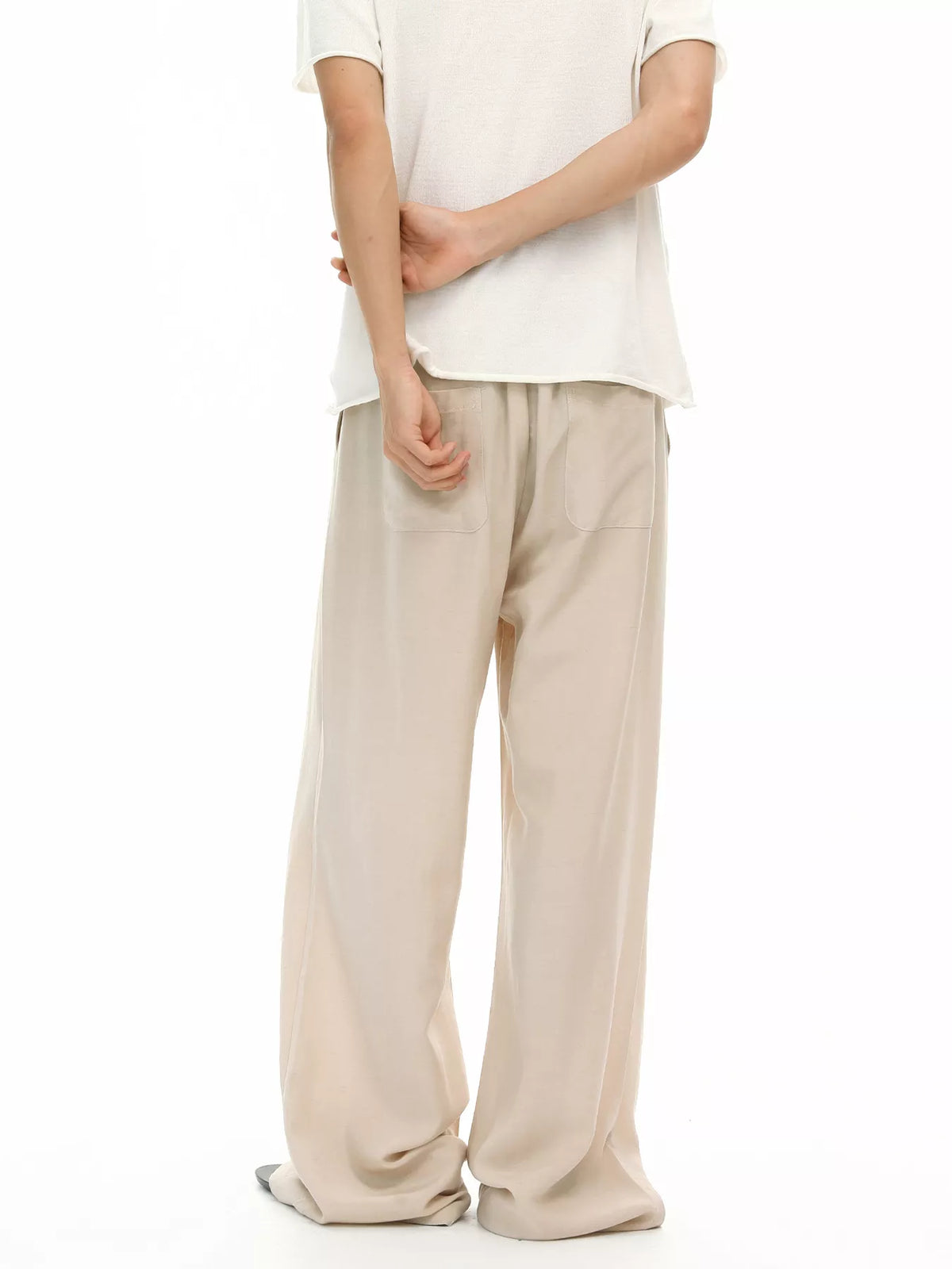 Khaki wide-leg drawstring pants with soft drape and side seam pockets