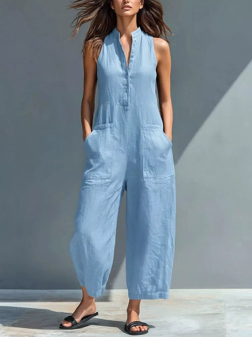 Sky blue sleeveless button-front jumpsuit with patch pockets and wide cropped legs