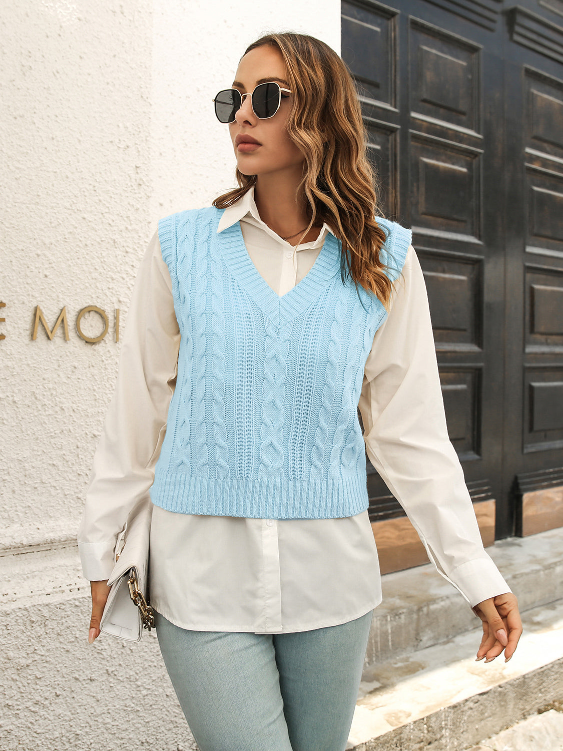 Pastel blue V-neck cable knit sweater vest, sleeveless with ribbed hem