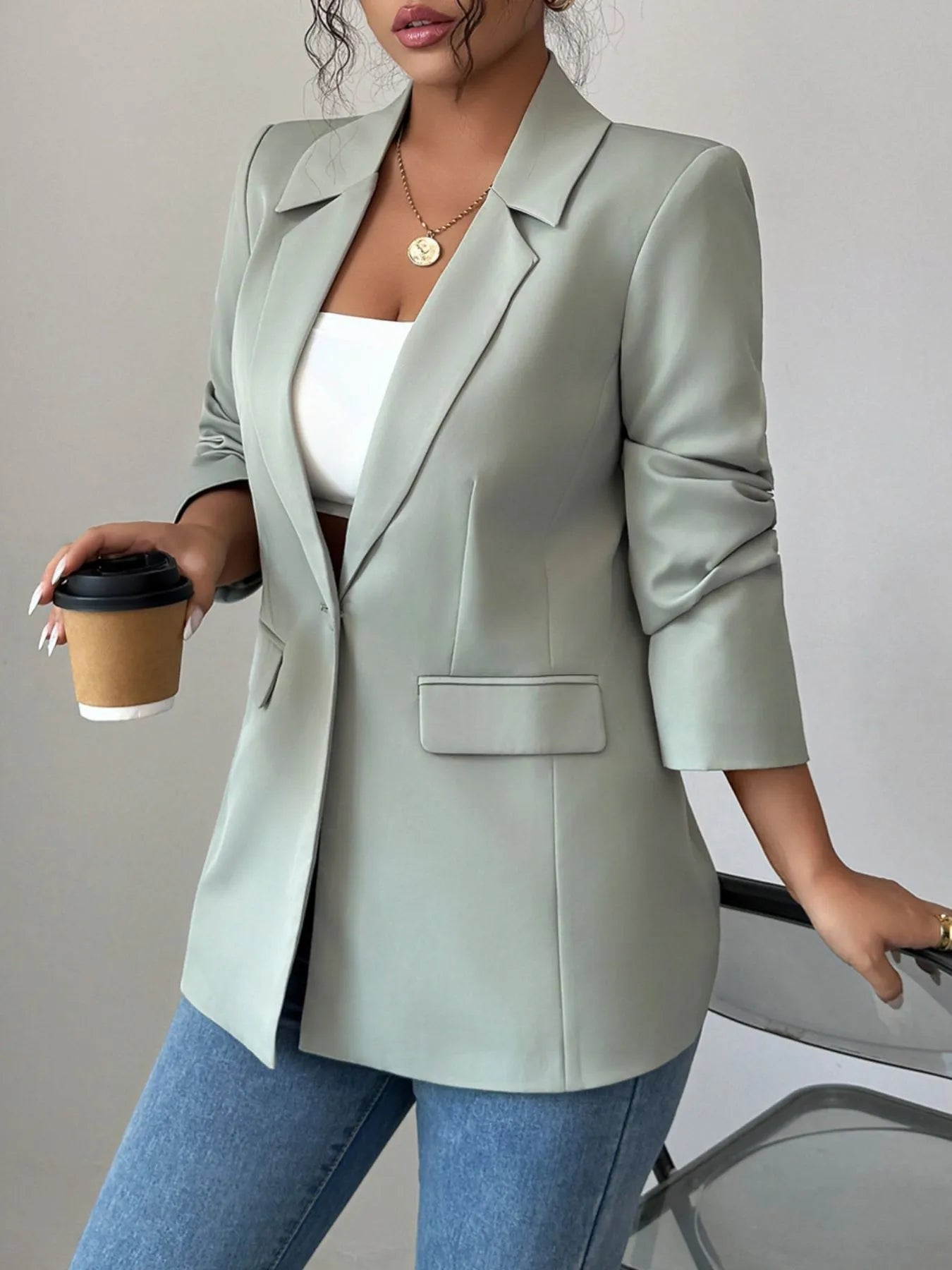 Light green one-button lapel blazer with single chest pocket