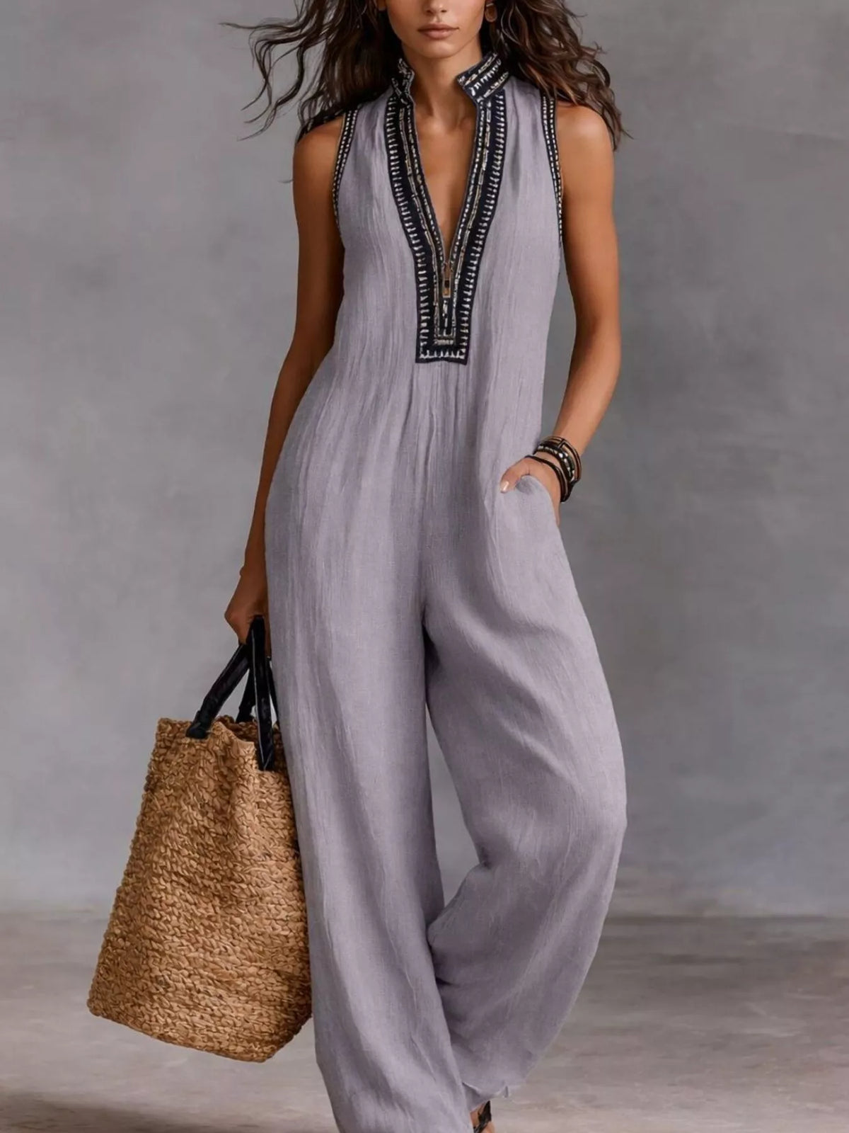 Lavender sleeveless wide-leg jumpsuit with V-neck and dark embroidered trim