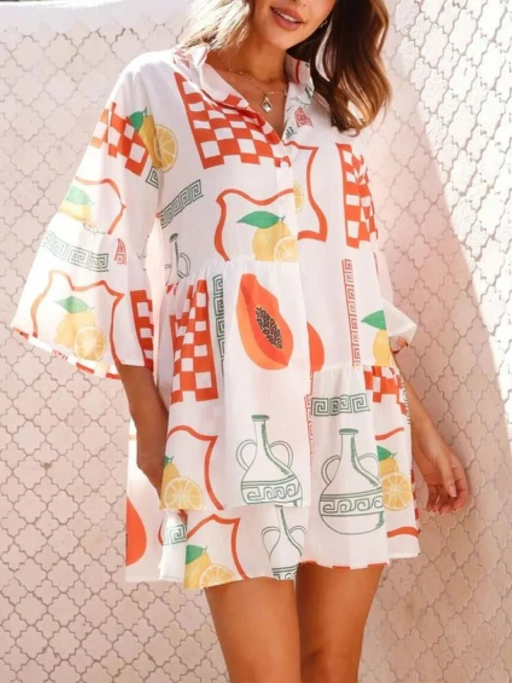 White printed mini dress with three-quarter sleeves and colorful fruit, flag and vase motifs