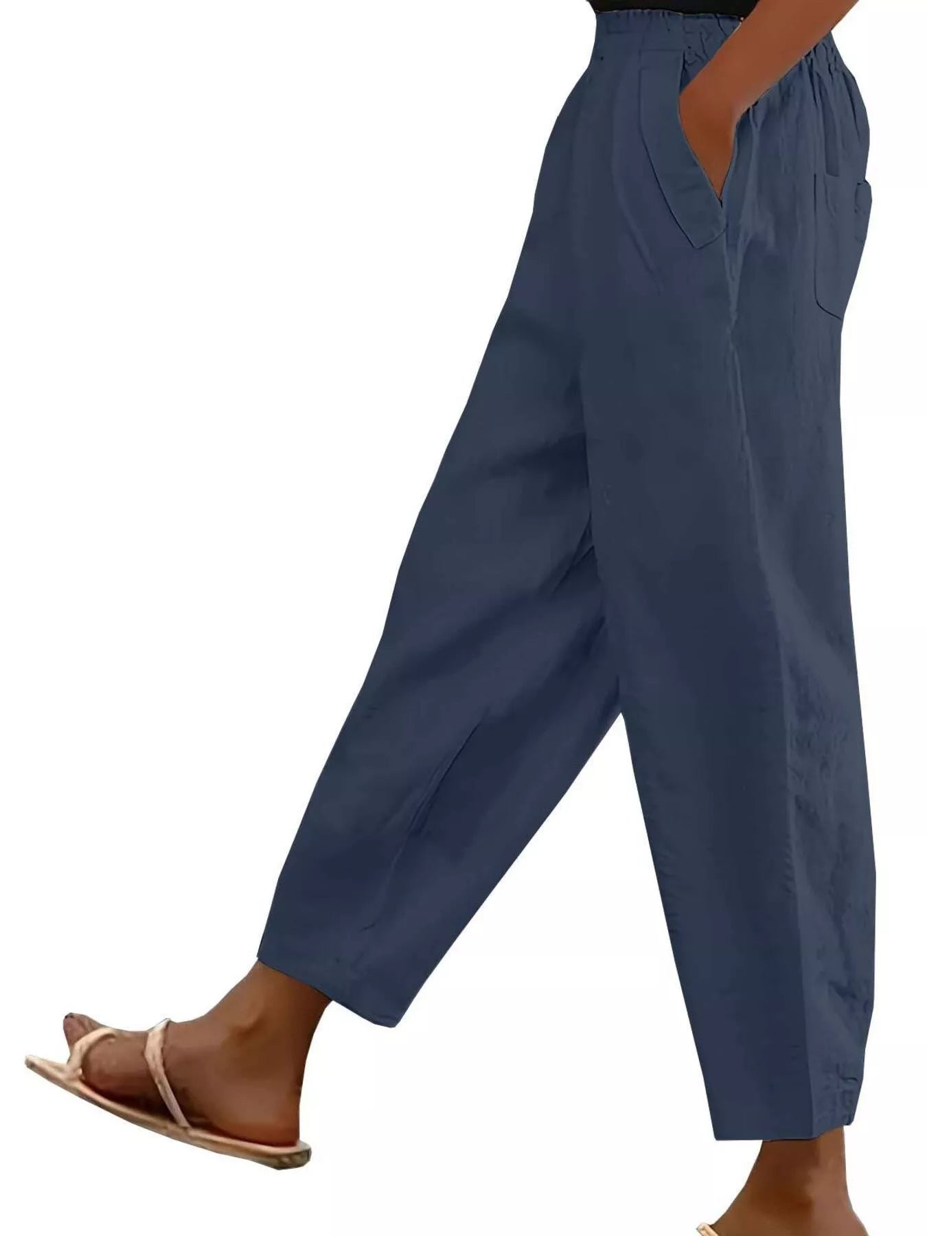 Navy loose-fit polyester pants with front pockets and tapered cuffs