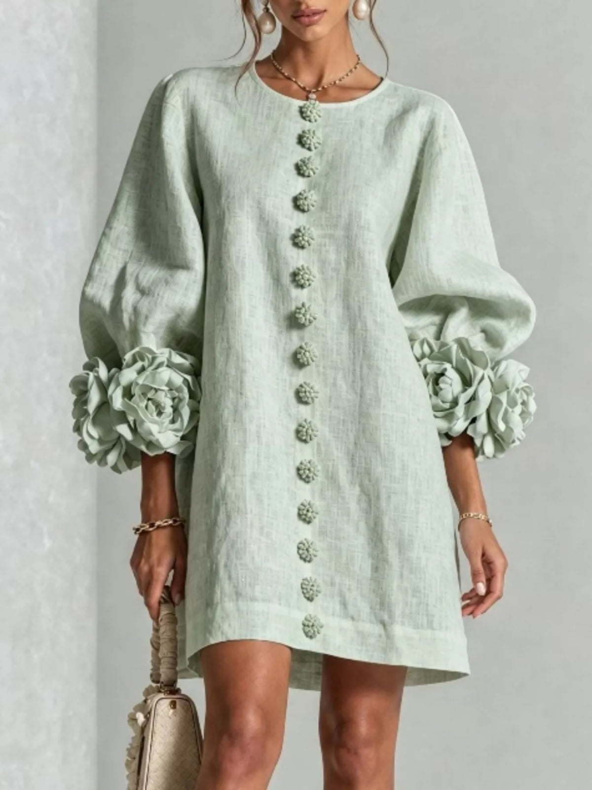 Light green round-neck polyester dress with long puff sleeves and 3D floral cuff accents