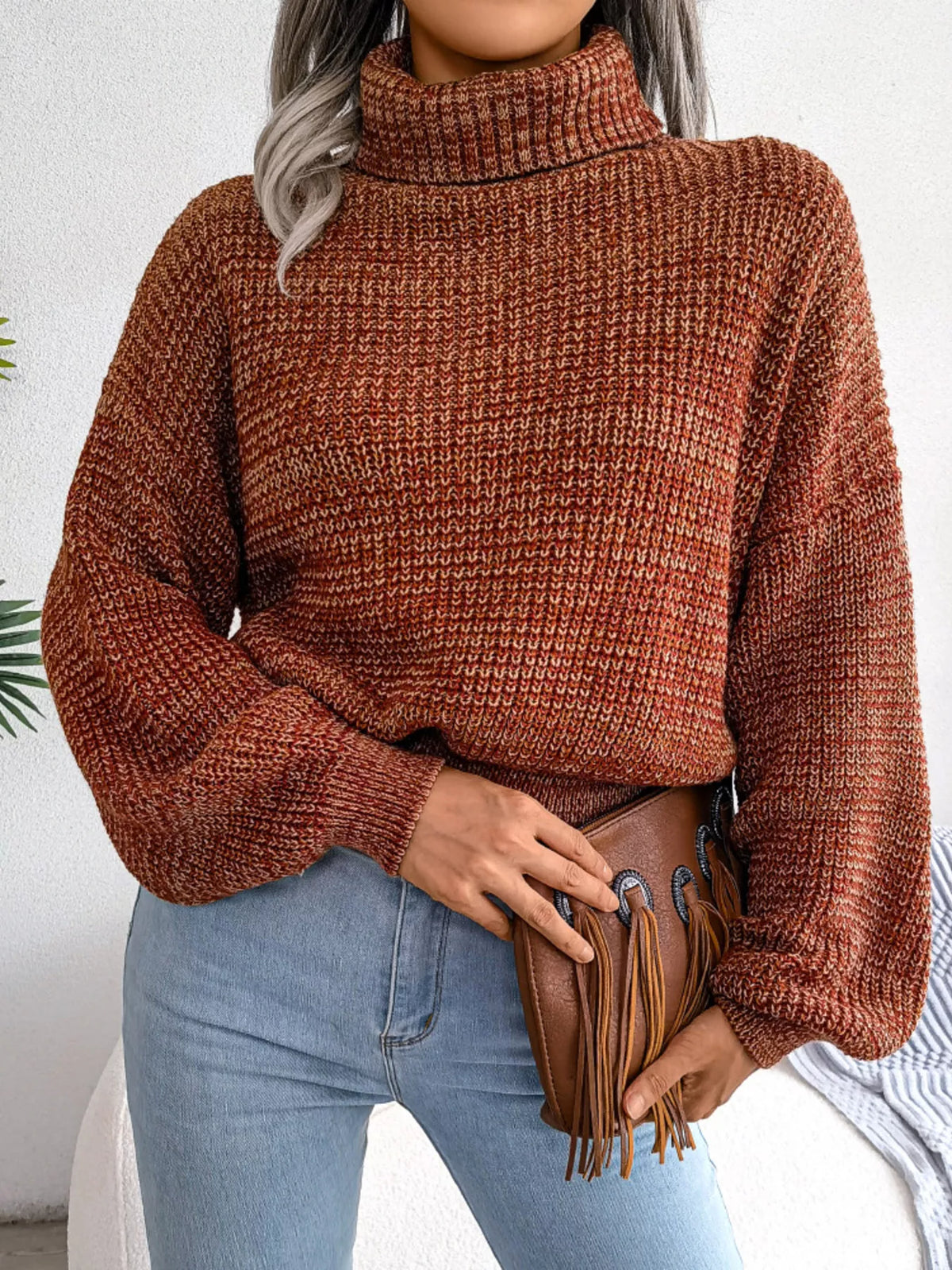 Caramel waffle-knit turtleneck sweater with long drop-shoulder sleeves and cuffs