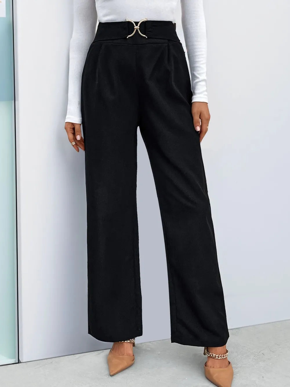 Black high-waist straight-leg pants with pleated front and gold-tone buckle
