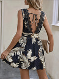 Printed V-Neck Sleeveless Mini Dress with lace back panels and belted waist in navy palm-leaf print.