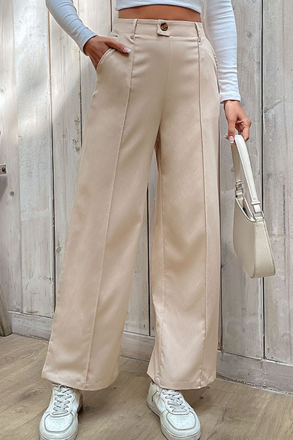 Beige wide-leg center-seam pants, high waist with belt loops and button front