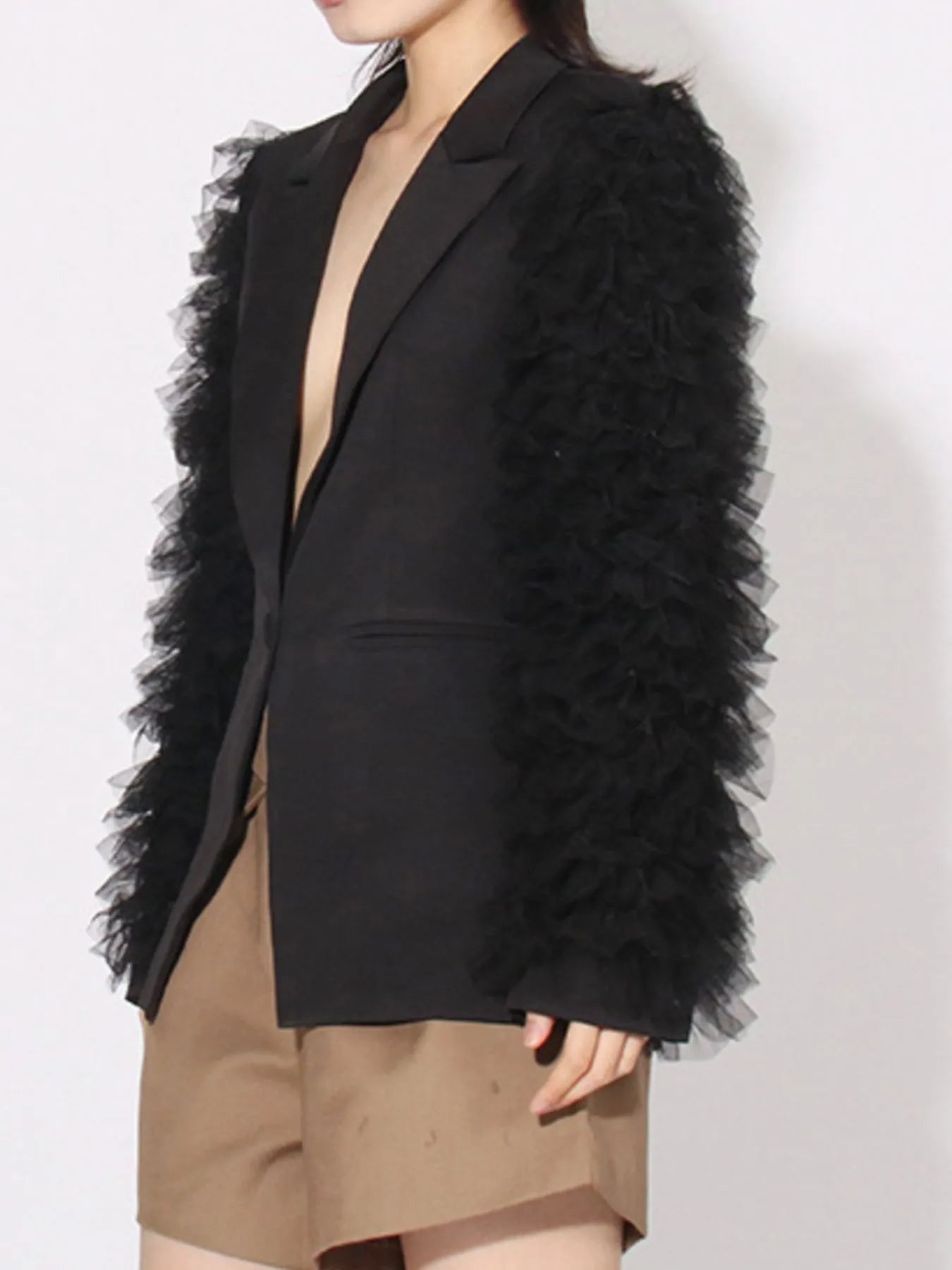 Black long-sleeve blazer with fluffy tulle sleeve detail and one-button front