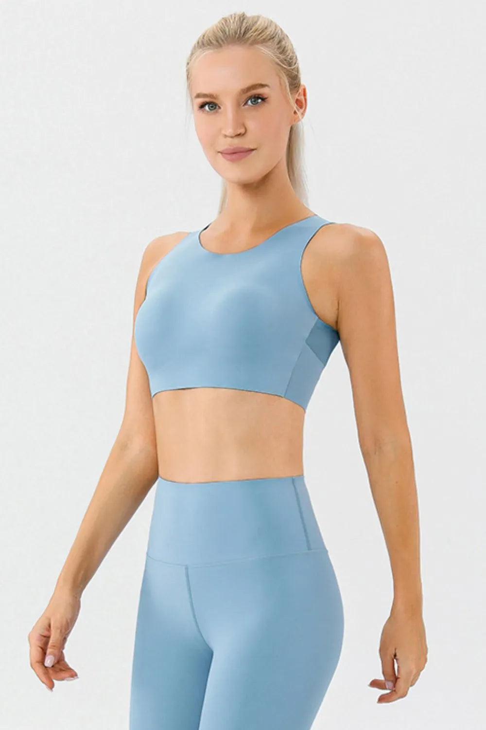 Light blue round-neck active bra with wide straps, front view