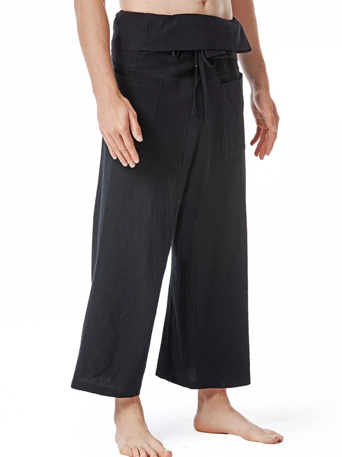 Black loose-fit drawstring pants with wide legs and gathered elastic waist