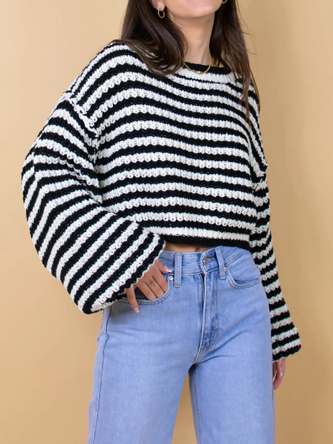 Black-and-white striped oversized drop-shoulder sweater with ribbed cuffs and hem