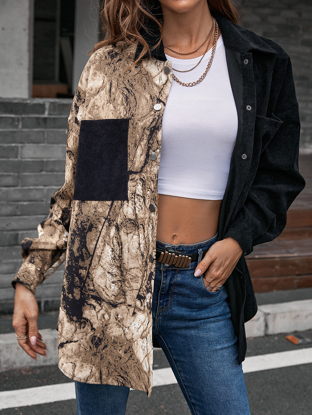 Collared contrast shirt with dropped shoulders, black top and beige patterned front panels