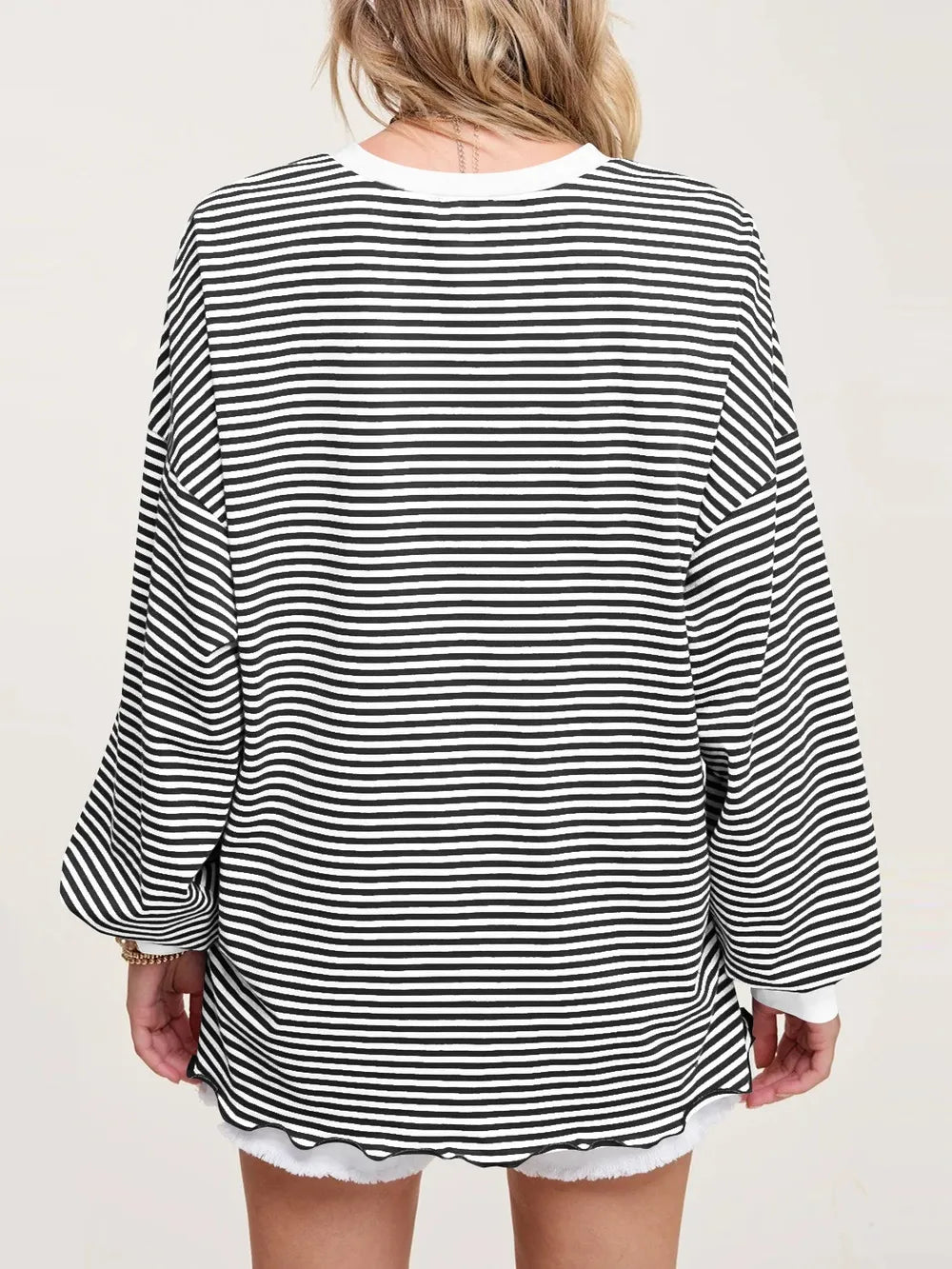 Contrast striped long sleeve sweatshirt in black and white, back view with wide sleeves