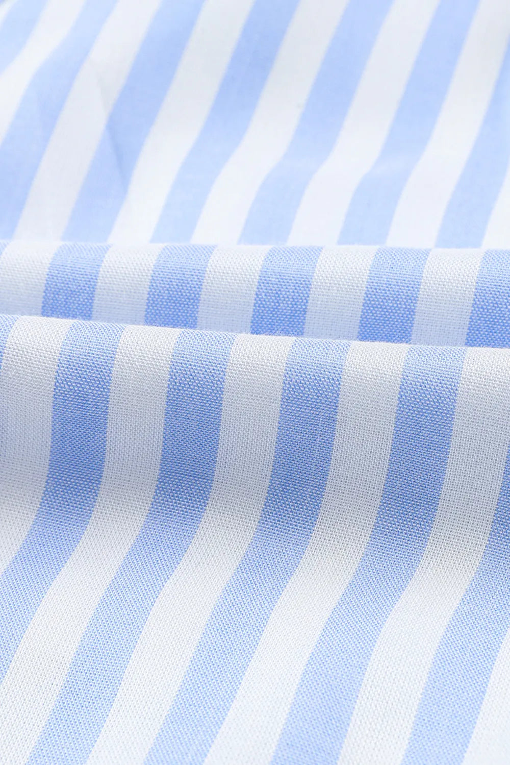 Striped woven romper fabric with light blue and white vertical stripes