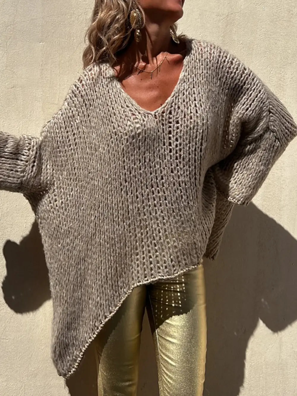 Camel textured knit V-neck long sleeve sweater with wide sleeves and curved hem
